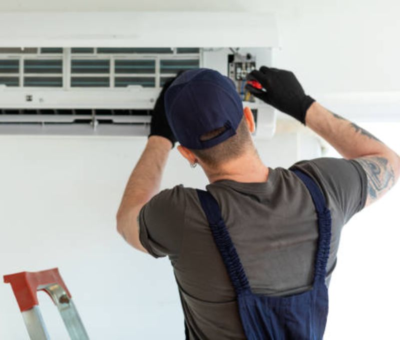 Technician performing annual HVAC tune-up in Florida